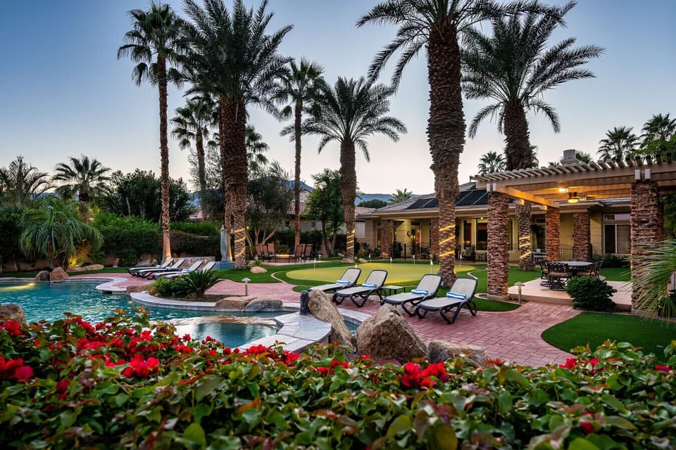 Backyard: pool & spa, large putting green, sun lounge chairs, natural gas fire-pit, outdoor kitchen area