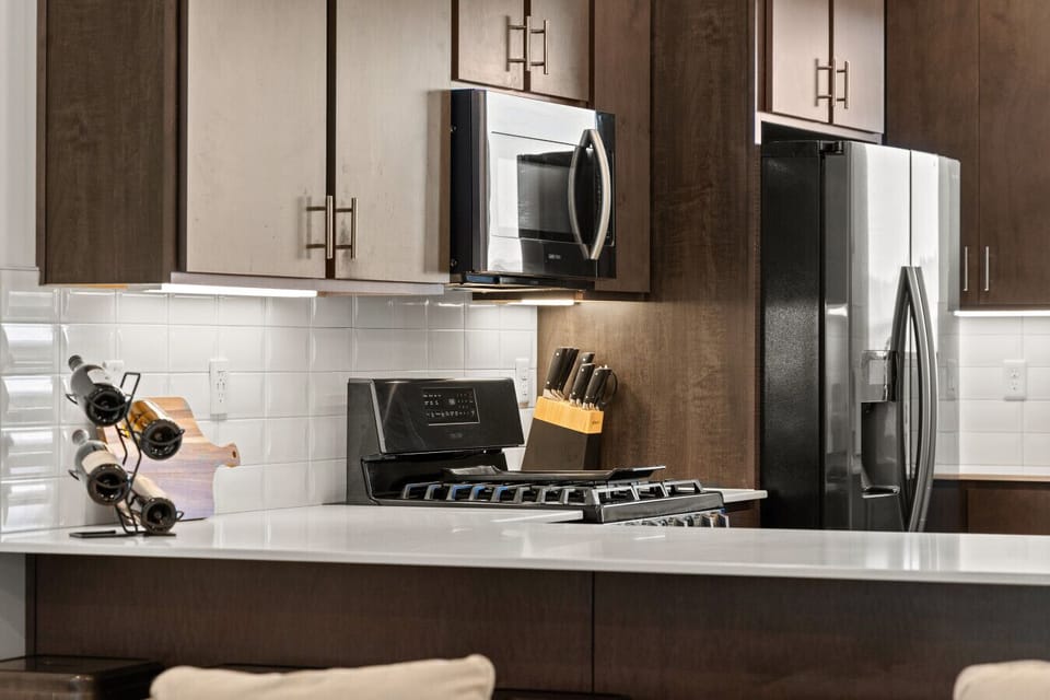 Kitchen: Whip up culinary delights in this modern kitchen with sleek appliances and stylish design!