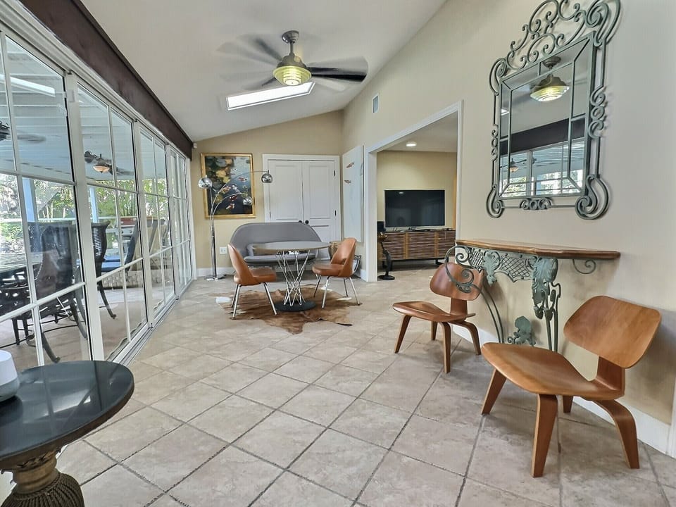 Kitchen alternate angle showing full layout with bar seating and view to living area