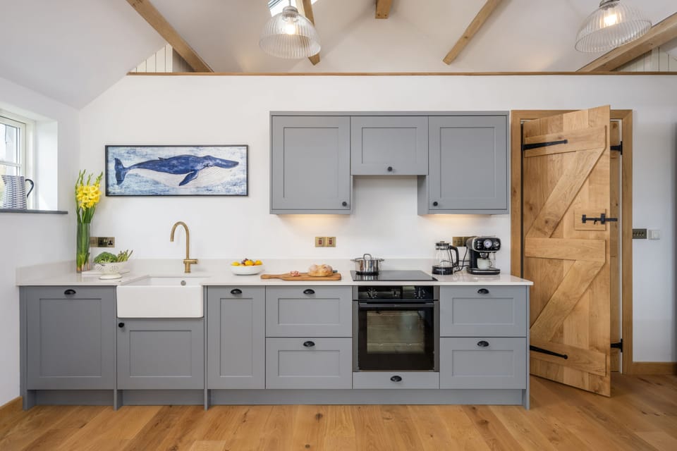The kitchen area with stylish Belfast sink and high-spec appliances