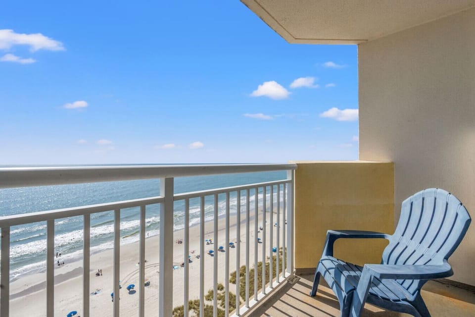 Start your day with stunning North Myrtle Beach sunrises from this private oceanfront balcony. Enjoy morning coffee with endless ocean views, or relax in the shade under the covered balcony; the perfect year-round coastal escape at Bay Watch Resort.