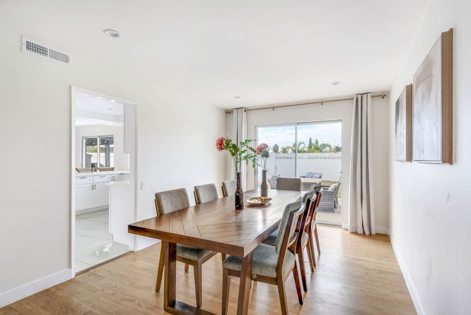 Enjoy family dinners or morning coffee in this airy dining space with direct backyard views.