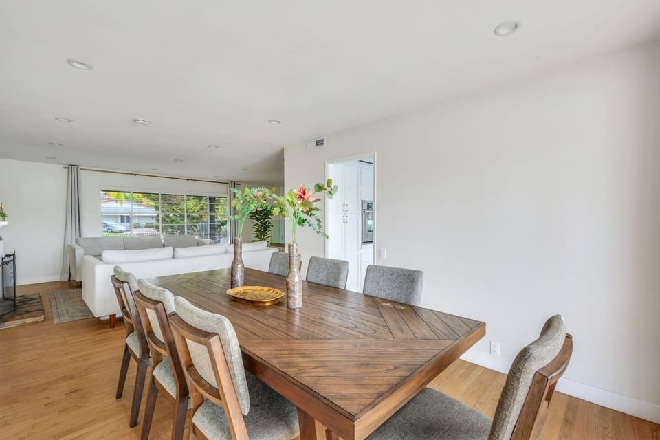 Spacious dining area with seating for seven, open to the living room for easy entertaining.
