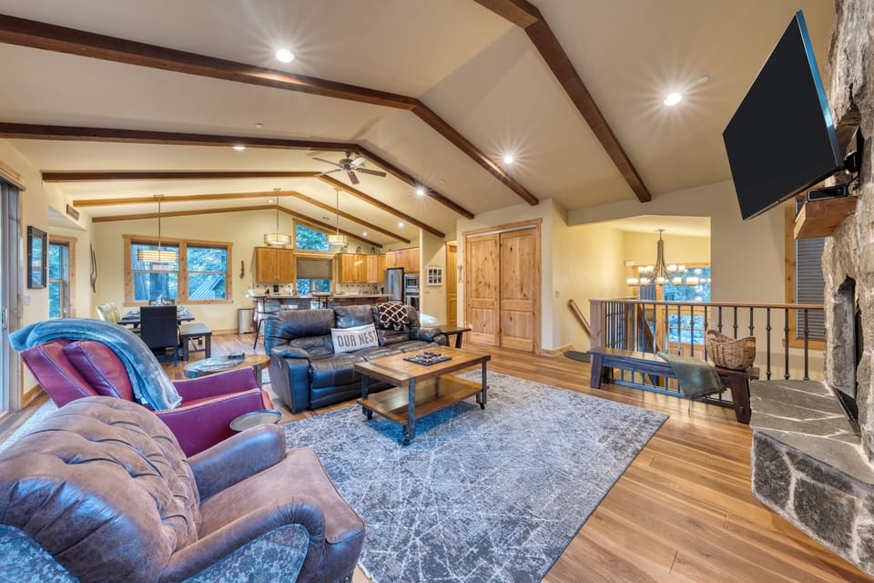 Living room with plush sofa and warm lighting.