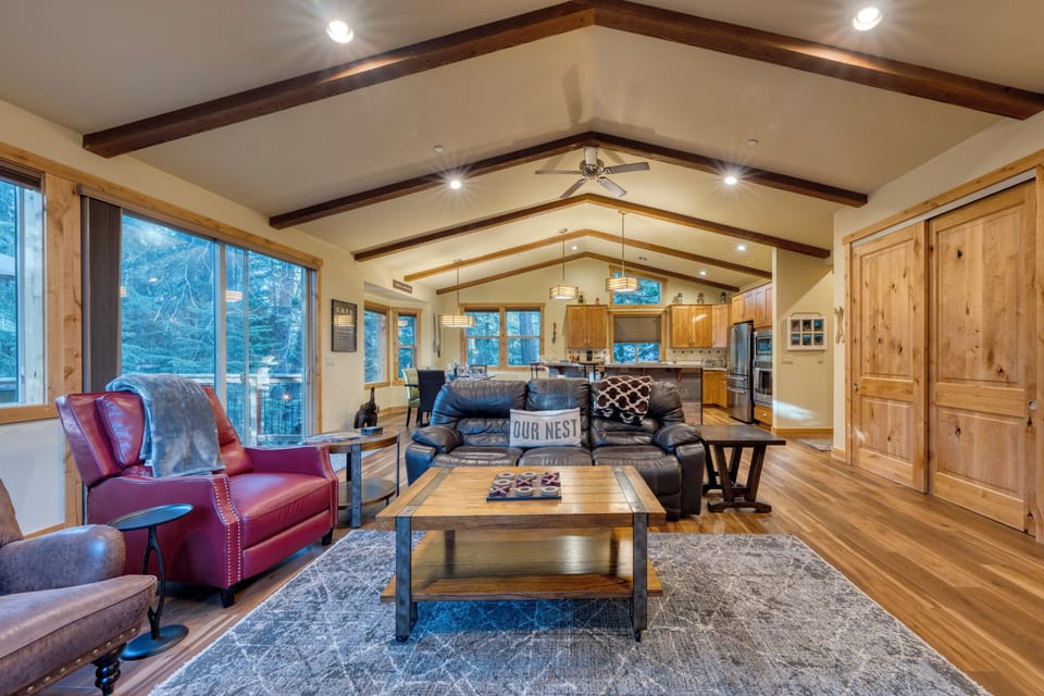 Spacious living area with vaulted ceiling and seating for all.