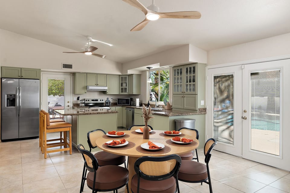 Kitchen dining table seats six, ideal for family or group meals together.