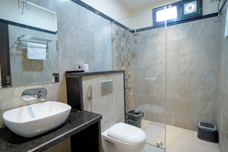 Shower, free toiletries, hair dryer, slippers