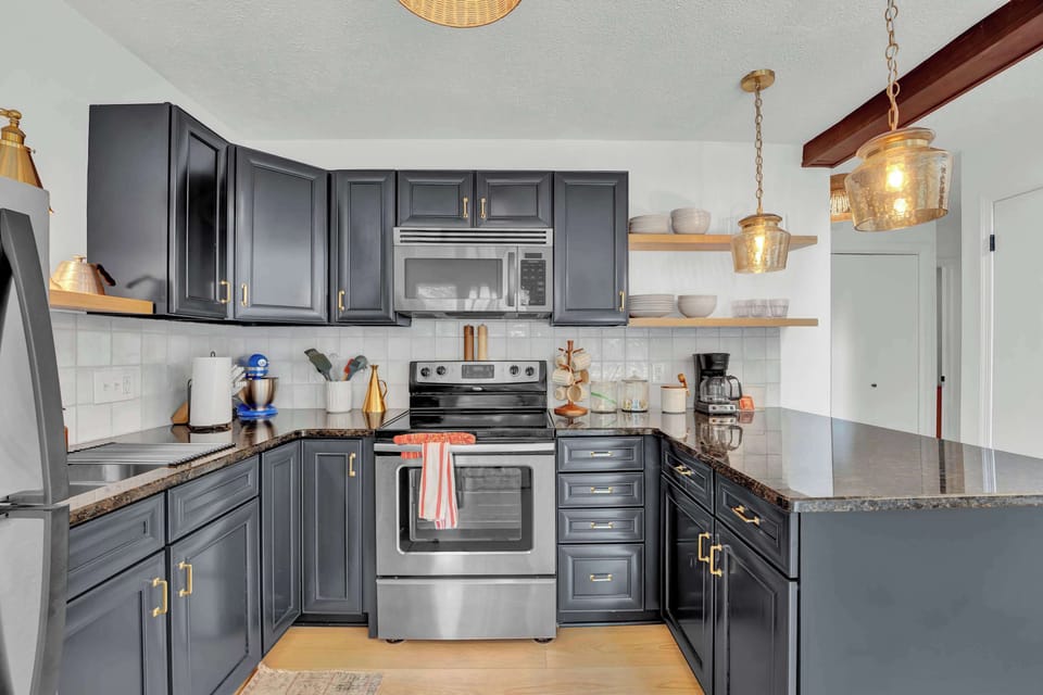 Spacious Kitchen with Granite Counters and Stainless Appliances
