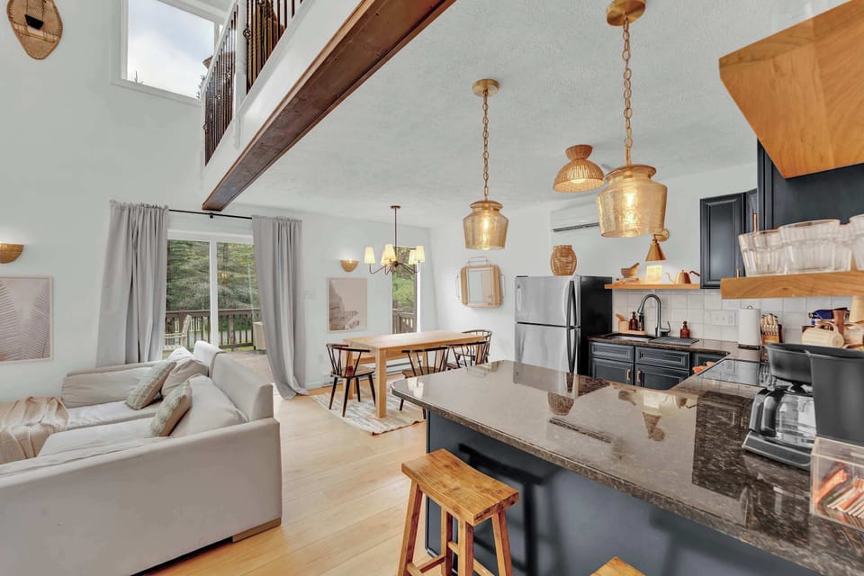Open Living and Kitchen Layout with Rustic Beams