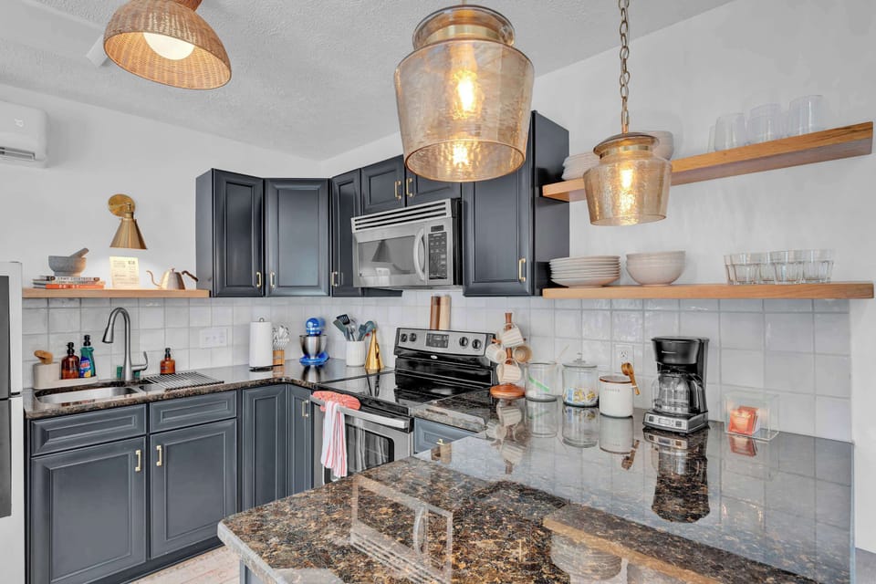 Modern Kitchen with Granite Counters and Open Shelving