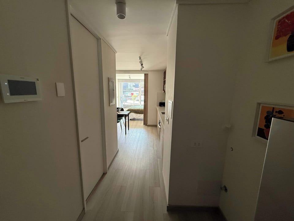 Bright and cozy studio with a modern kitchen and dining area, perfect for a comfortable stay in the heart of the city.