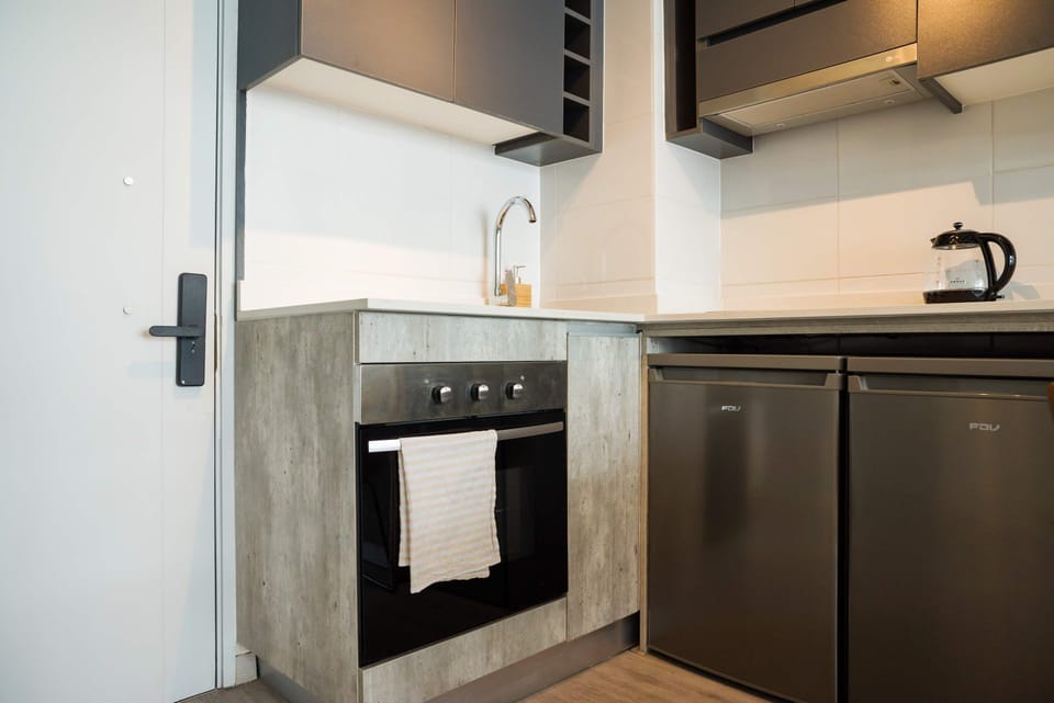 Sleek and modern kitchen with stainless steel appliances, perfect for cooking your favorite meals.