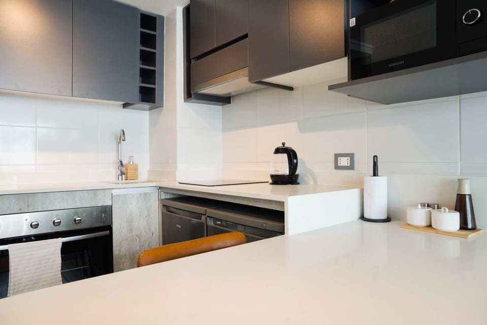 Sleek and modern kitchen with all essentials for a comfortable stay in the heart of the city.
