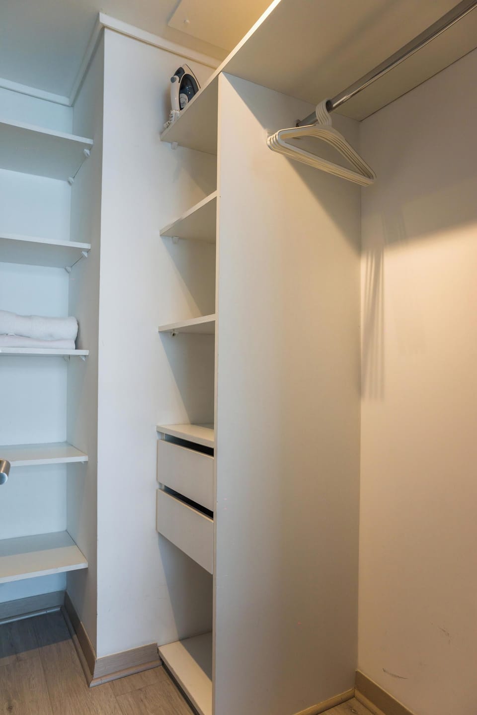 Spacious closet with ample storage and essentials for a comfortable stay.