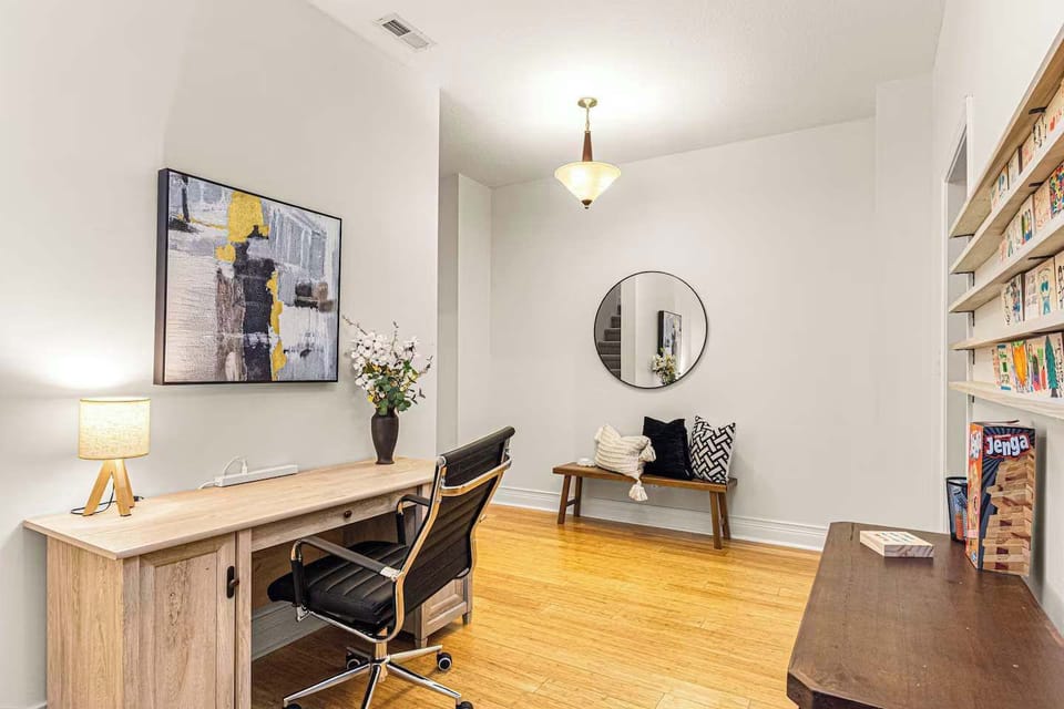 Dedicated workspace in the basement landing. Ideal for remote work or quiet focus time, just steps from the movie theatre and living area.