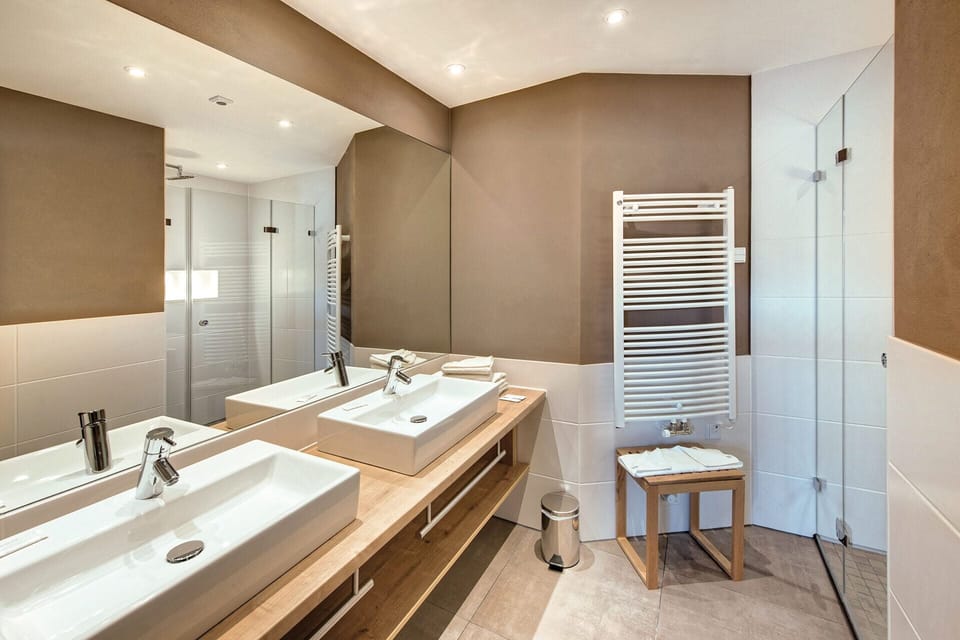 Suite, Garden View | Bathroom | Shower, hair dryer, towels, soap