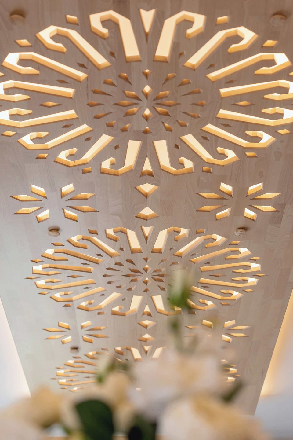 Elegant chandelier detail – Beautiful ceiling lighting that adds a warm, luxurious glow to the apartment.