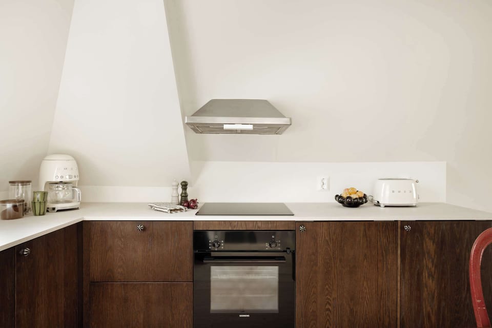 Cook freely in a smartly designed kitchen that combines style and practicality—perfect for preparing simple meals or local favorites