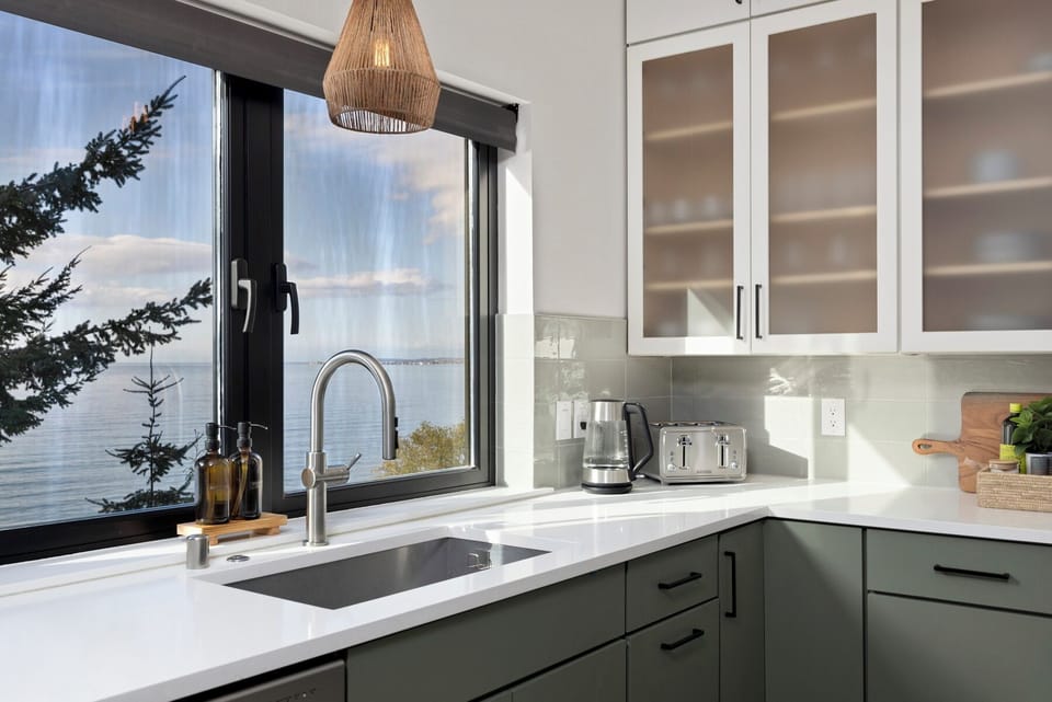 Coastal charm meets functionality — enjoy morning coffee with a view from the kitchen window.