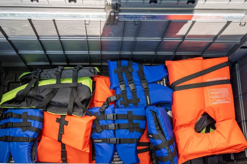 Life jackets for safety are conveniently stored in the deck box behind the hot tub—please use them during your river adventures.