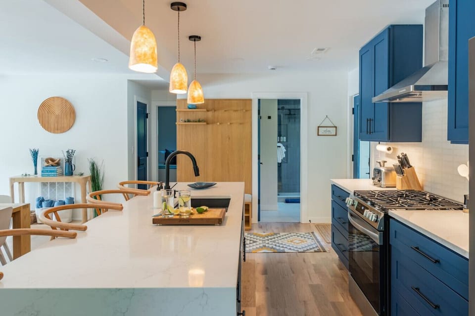 Spacious open kitchen with Quartz counters and stainless appliances.