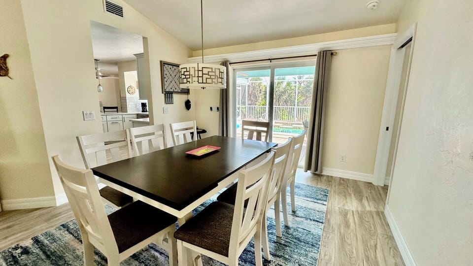 Extendable table seats 6 - 8; pool view.