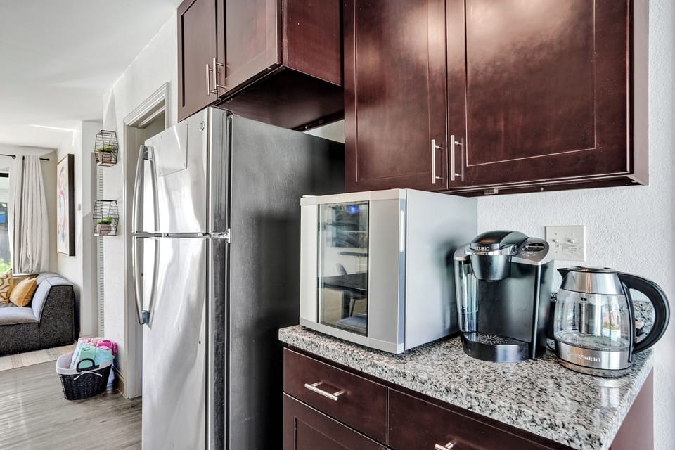 Coffee station with wine fridge for morning or evening drinks.
