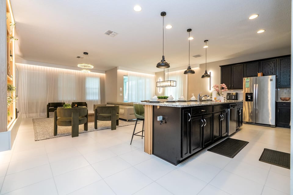 Spacious modern kitchen and dining area with sleek island seating
