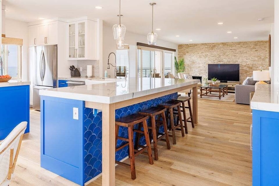 Additional seating for seven at the kitchen counter with sleek bar stools.