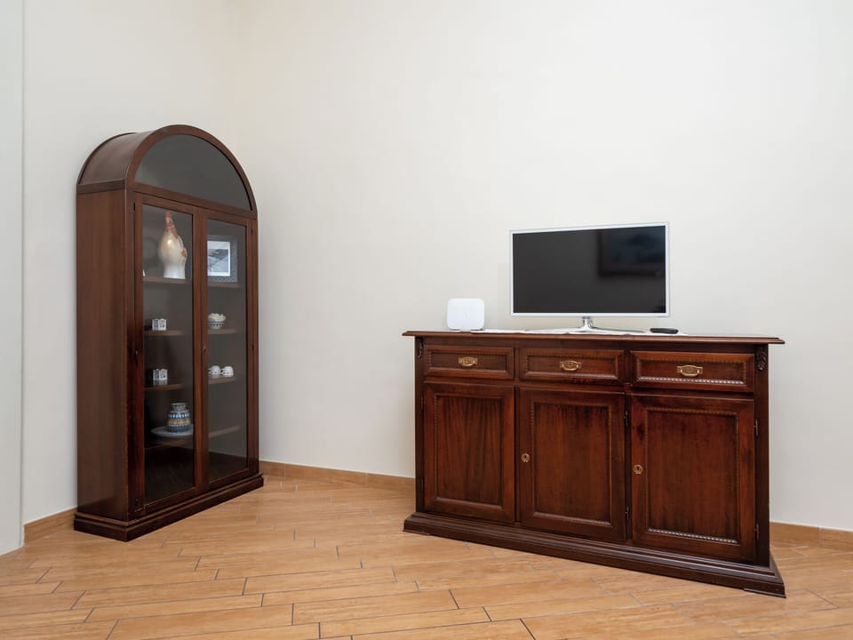 Exclusive Apartment, Balcony, City View | Living area | 36-inch flat-screen TV with digital channels