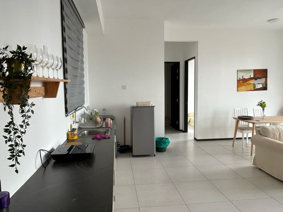 Comfort Apartment, City View | Private kitchen | Fridge, highchair, cookware/dishes/utensils, dining tables