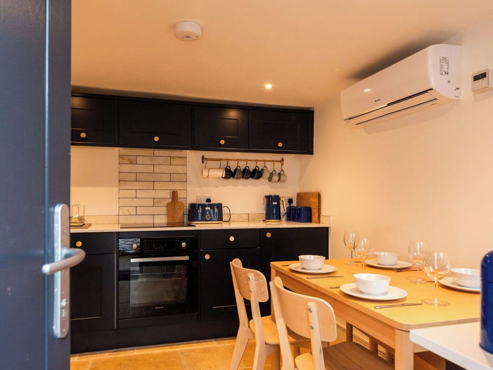 Interior Design, Furniture, Kitchen, Wood, Flooring, Countertop, Major Appliance, Ceiling, Cabinetry, Kitchen Appliance