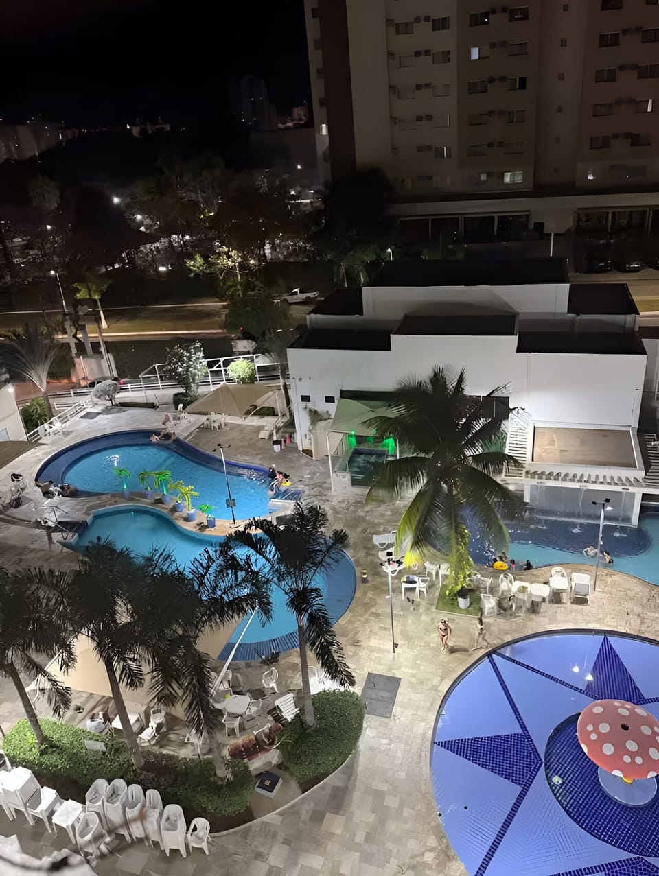 View from the apartment balcony, looking down onto the five resort pools