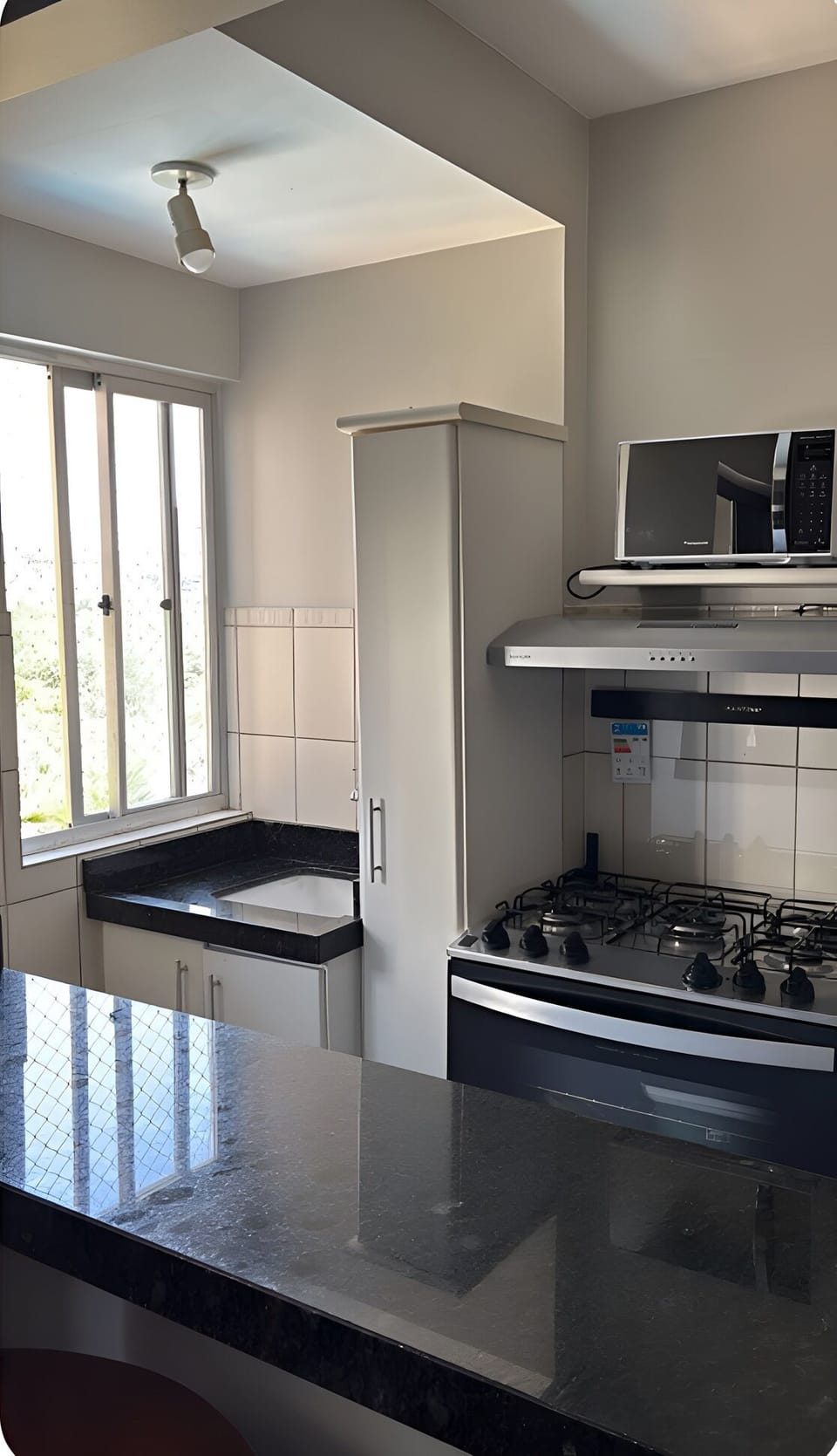 Fully fitted kitchen with gas stove and oven, microwave, and all cooking utensil