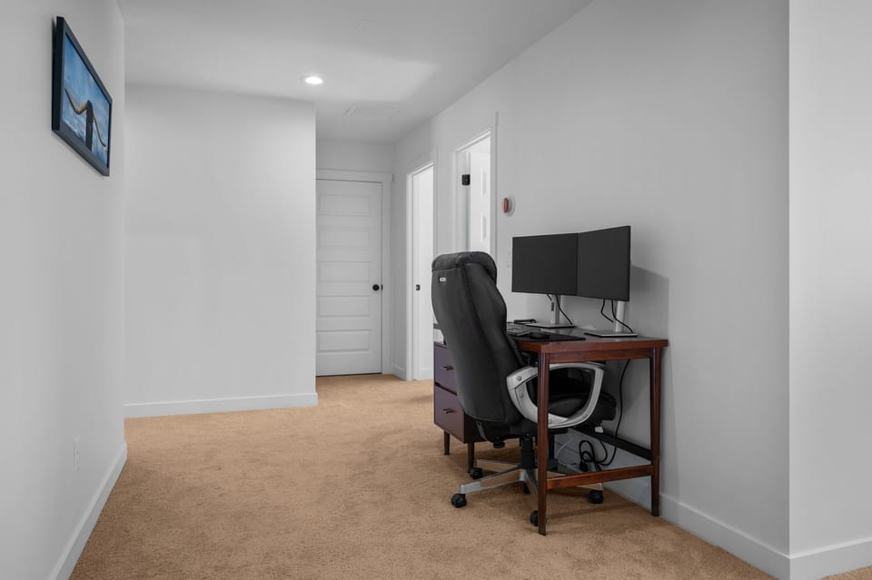 Quiet upstairs office with desk, chair, and high-speed Wi-Fi — ideal for remote work or catching up on emails.