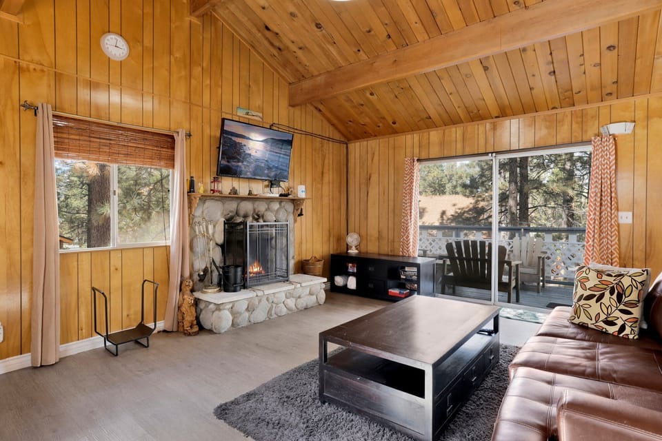 Spacious living room with patio access, perfect for relaxing and enjoying fresh mountain air.
