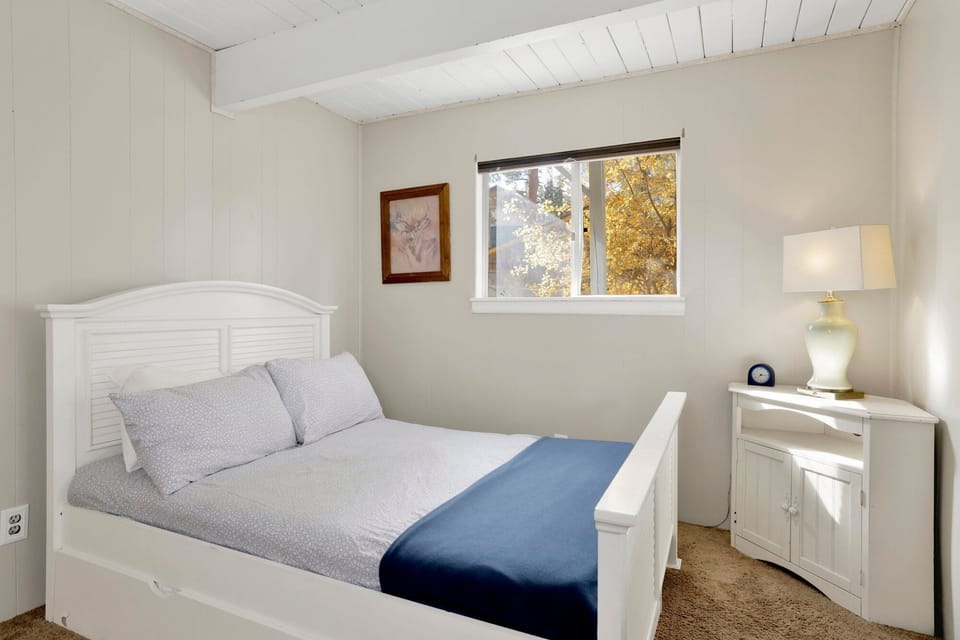 Bedroom includes one full-size bed and one twin bed