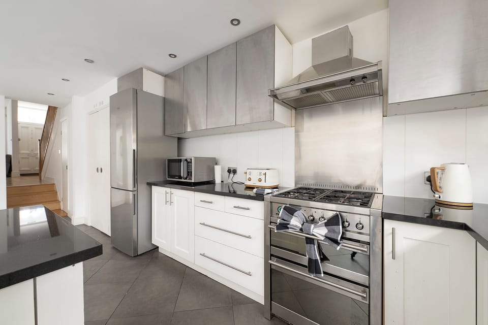 Luxury House | Private kitchen | Full-size fridge, microwave, oven, stovetop