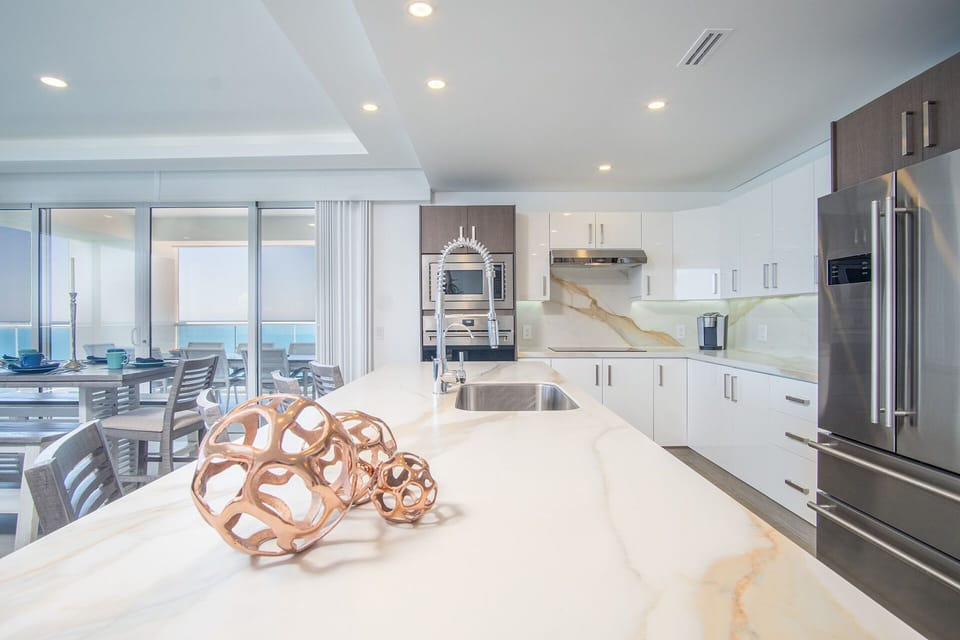 Condo, Multiple Beds, Balcony, Ocean View (Encantame Towers Velero 2101) | Private kitchen | Dining table