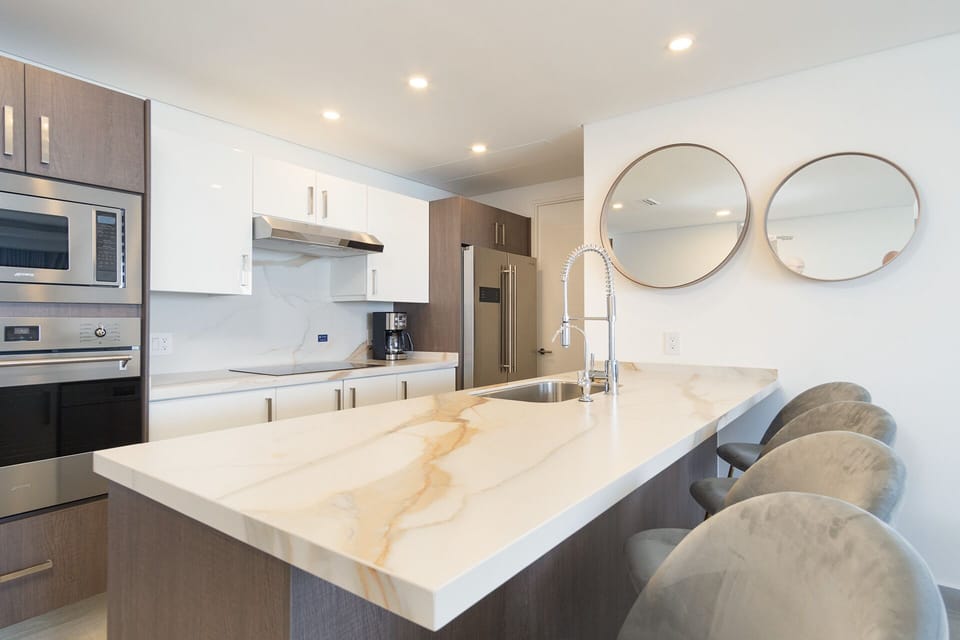Condo, Multiple Beds, Balcony, Ocean View (Encantame Towers Velero 1002) | Private kitchen | Dining table