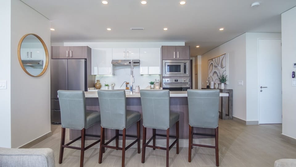 Condo, Multiple Beds, Balcony, Ocean View (Encantame Towers Verano 1405) | Private kitchen | Dining table