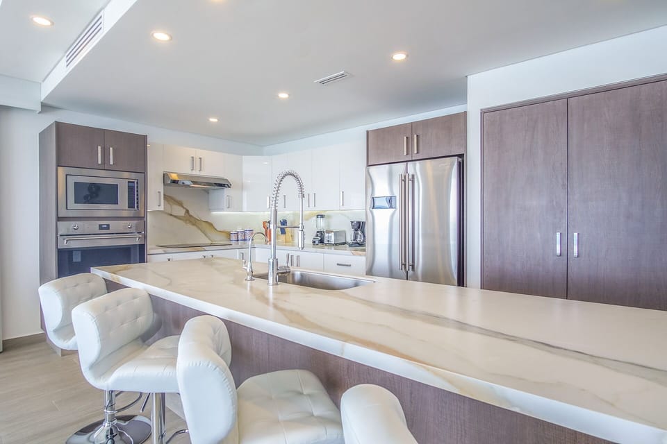 Condo, Multiple Beds, Balcony, Ocean View (Encantame Towers Velero 1801) | Private kitchen | Dining table