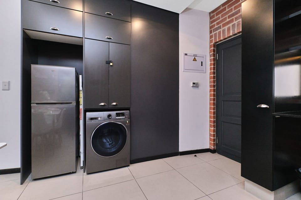 2 in1 washer/dryer with an iron and an ironing board provided
