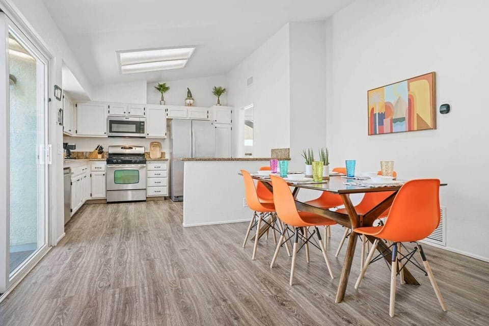 Dining table seats 7-8 people and has a view of the pool. We also have 2 stools at the peninsula to seat a total of 10 diners comfortably.

There’s a high chair (in bunk room closet) for our littlest guests.

Sliders to pool have child locks. 