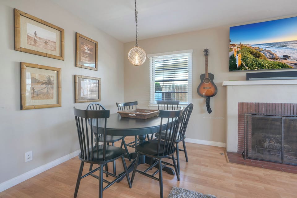 Chic dining nook by tv —guitar serenades.