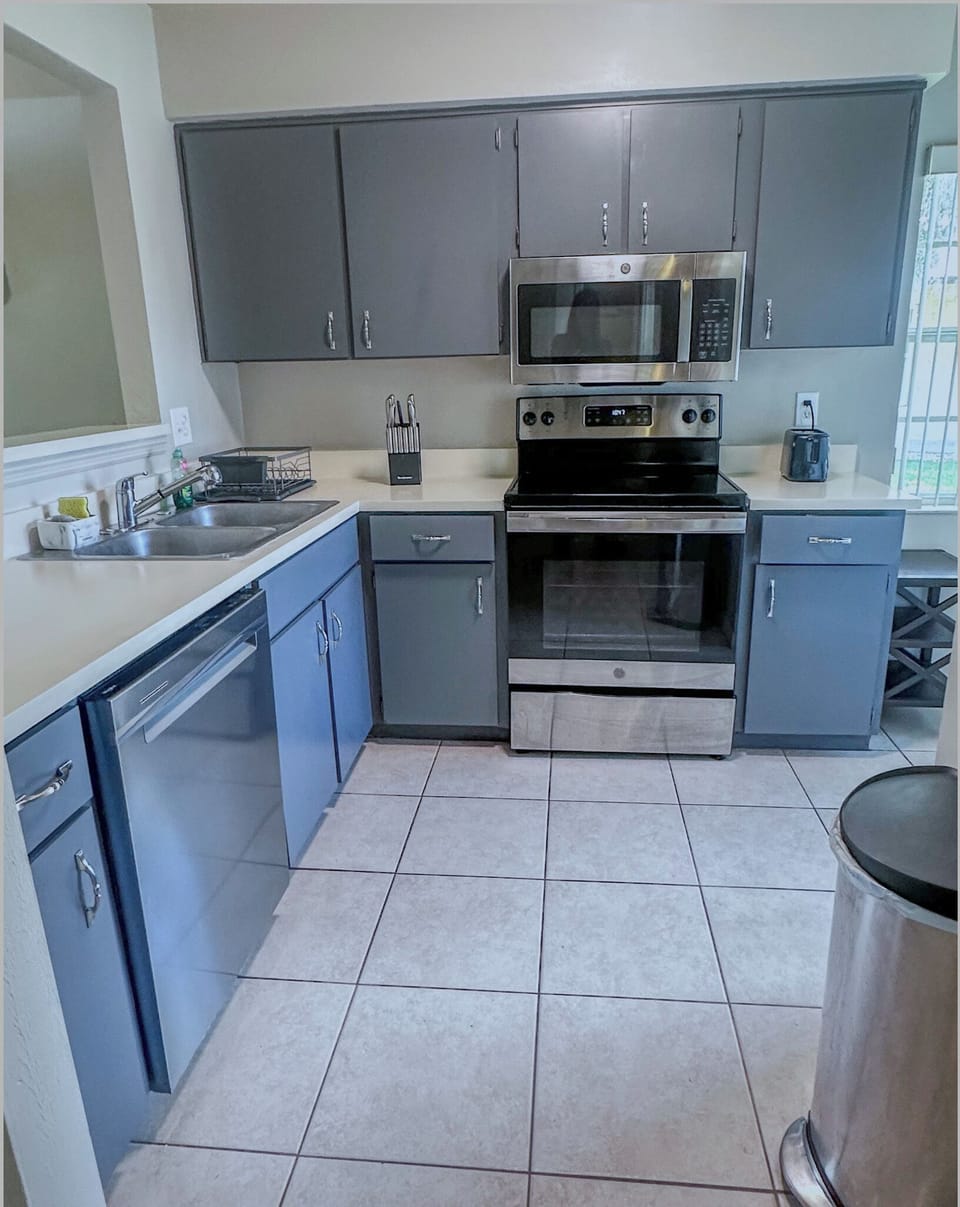 Kitchen, dishwasher, oven, stove, full size refrigerator 