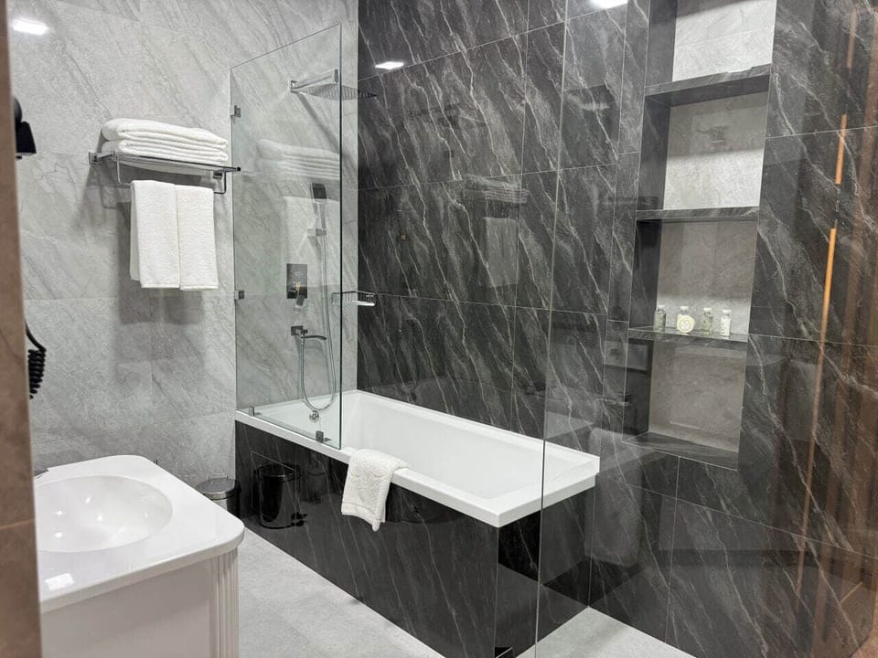 Hair dryer, slippers, bidet, towels