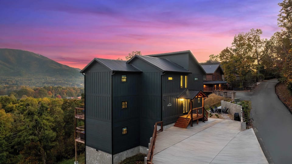 Aerial footage of cabin with large driveway. Equipped with a Tesla Charger, and can fit up to 4 large vehicles. 