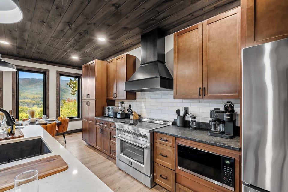 Granite countertops, stainless steel appliances, and large island. The Perfect Kitchen arrangement. 
