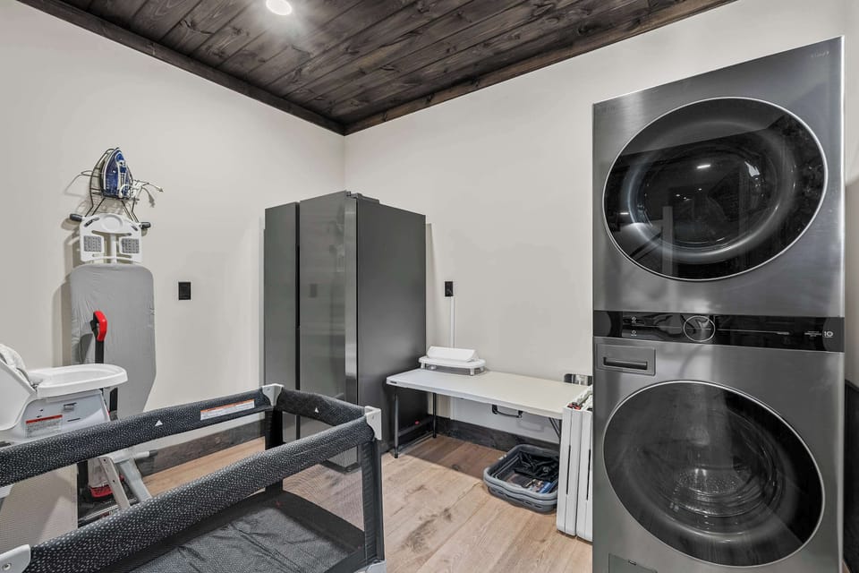 Full size Laundry Room and Extra Stainless steel fridge. Pack and Play and High Chair stored as well. 